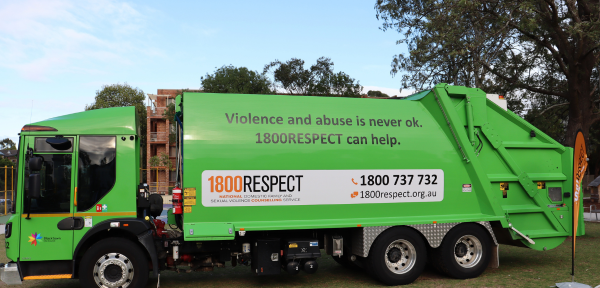Image of Blacktown City Council Garbage Truck with 1800RESPECT logo and Phone number (1800 737 732) and tagline "Violence and abuse is never ok. 1800RESPECT can help."